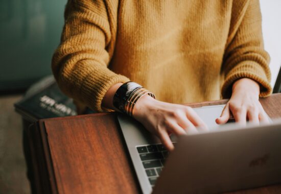 Person typing on keyboard